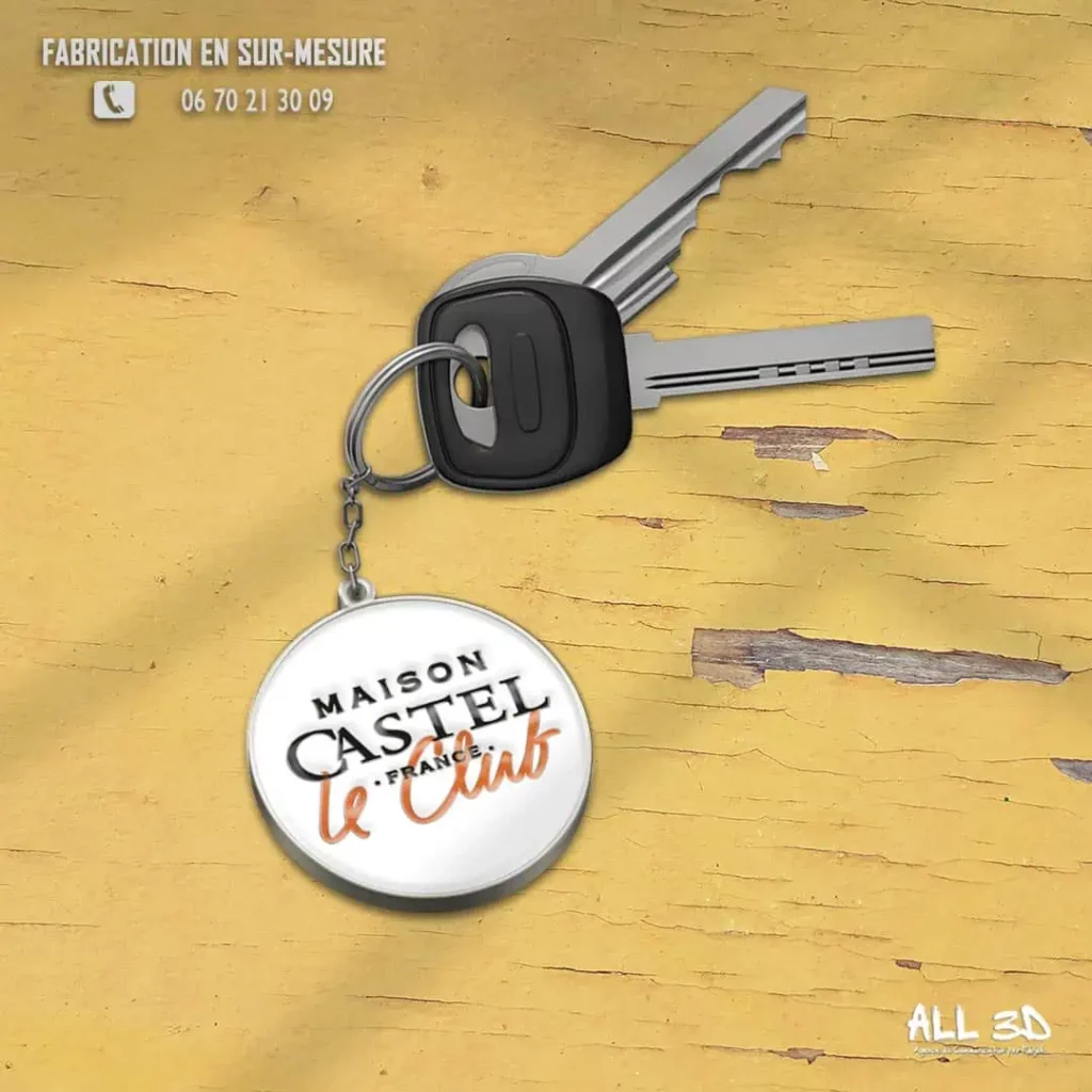 Fabrication de porte-clés en métal émaillé 2D personnalisés pour la Maison Castel, fabricant de Champagne